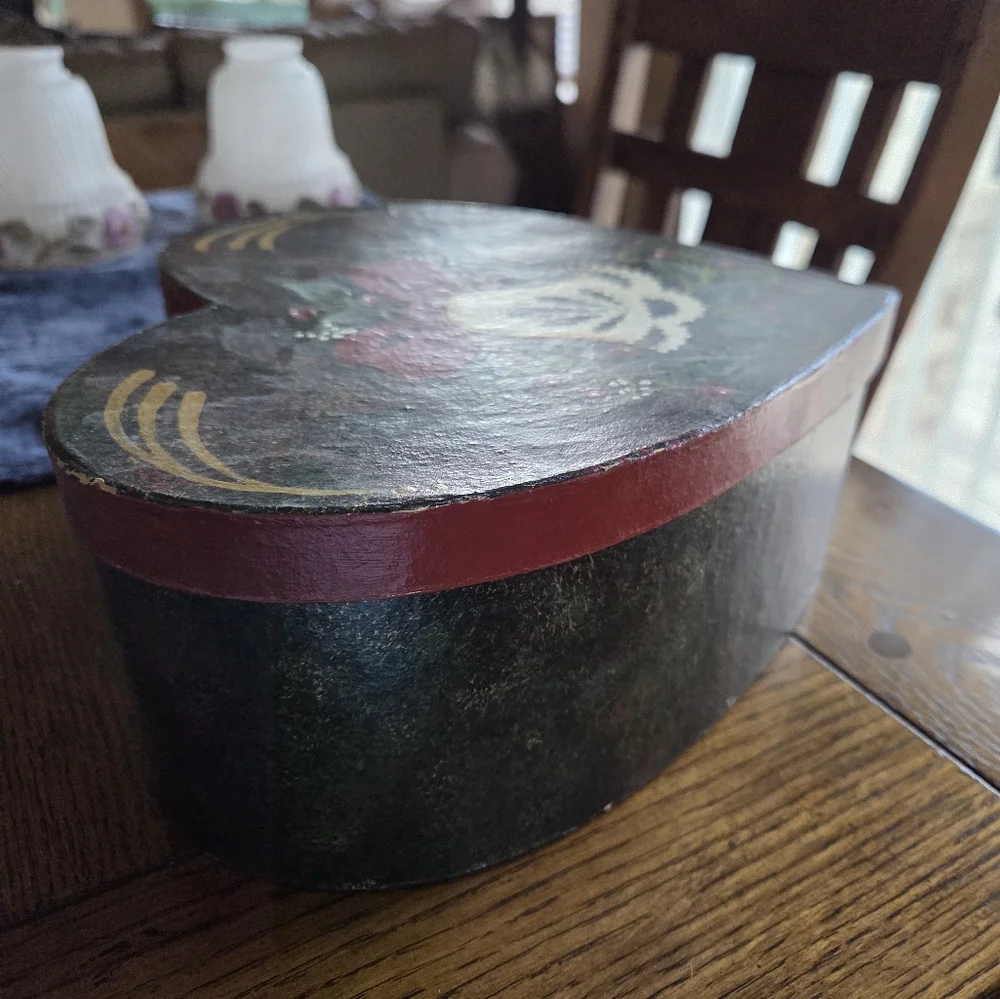 Folk Art Painted Heart Shaped Box With A Christmas Bell Painted On Top.